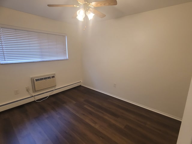 spare room with dark wood-type flooring, baseboards, baseboard heating, a wall mounted AC, and a ceiling fan