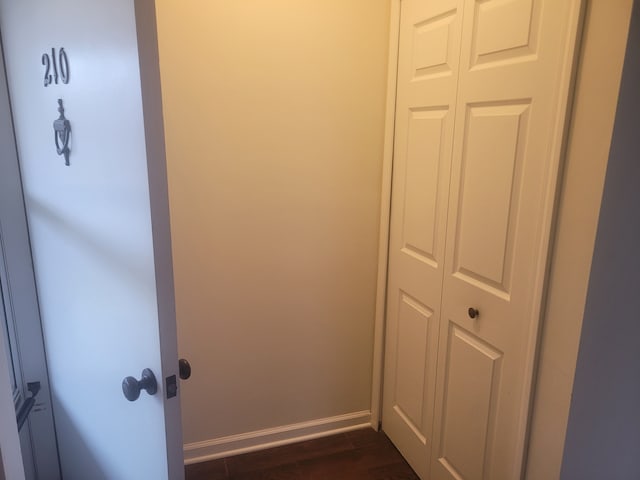 interior details with baseboards and wood finished floors