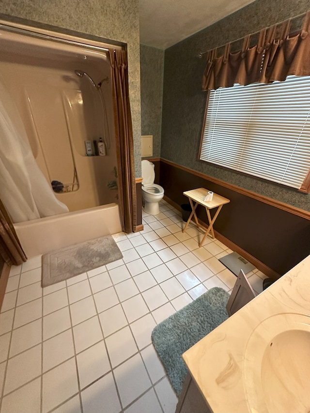 bathroom featuring toilet, tile patterned flooring, wallpapered walls, bathtub / shower combination, and vanity