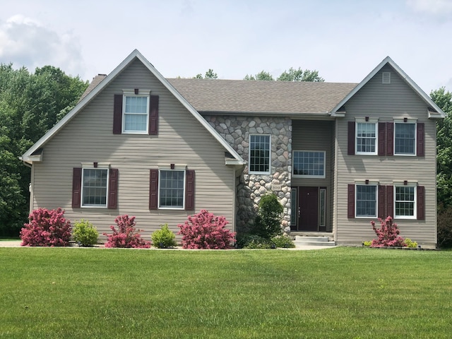 view of front of property with a chimney, a shingled roof, and a front lawn