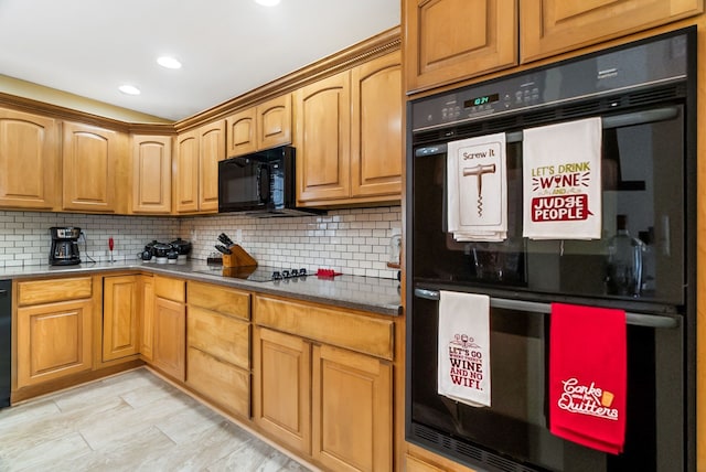 kitchen with recessed lighting, decorative backsplash, and black appliances