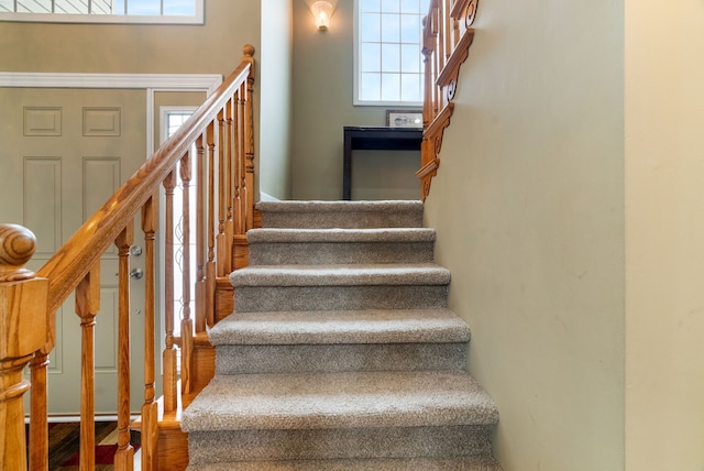 staircase with wood finished floors