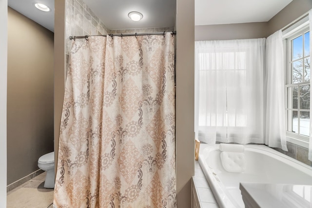bathroom with toilet, curtained shower, and a bath