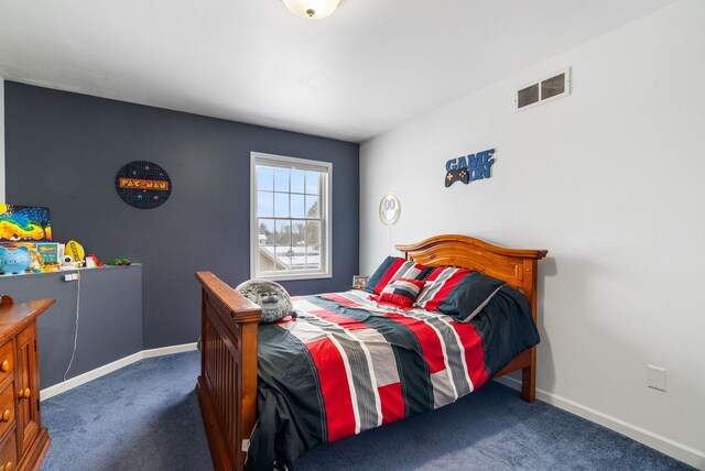 bedroom with carpet floors, baseboards, and visible vents