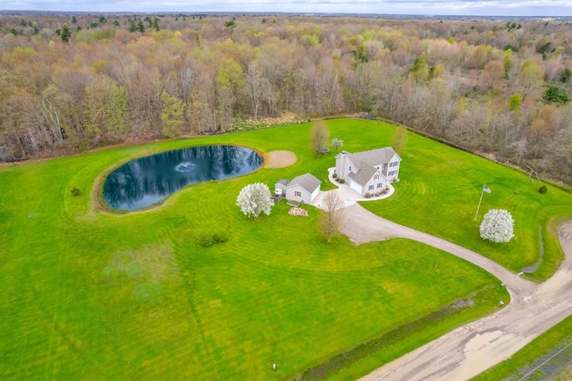 drone / aerial view featuring a water view and a view of trees