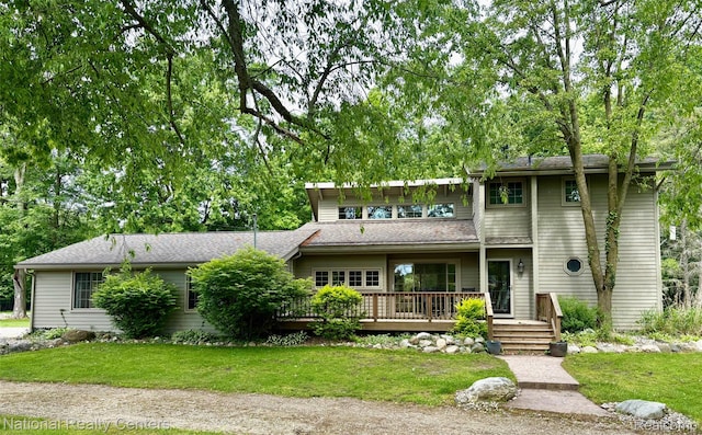 9247 Schrepfer Rd, Howell, MI 48855 - view of front of house with a deck and a front lawn