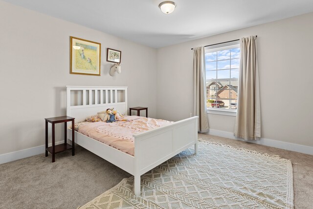 carpeted bedroom with baseboards