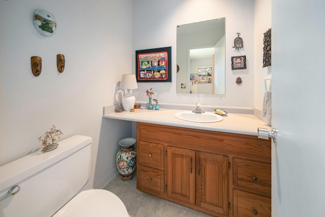 bathroom with toilet and vanity