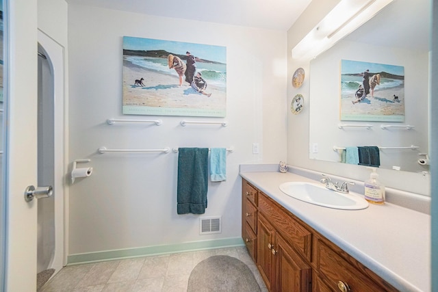 bathroom with visible vents, baseboards, and vanity