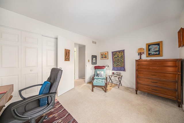 office featuring visible vents and light carpet