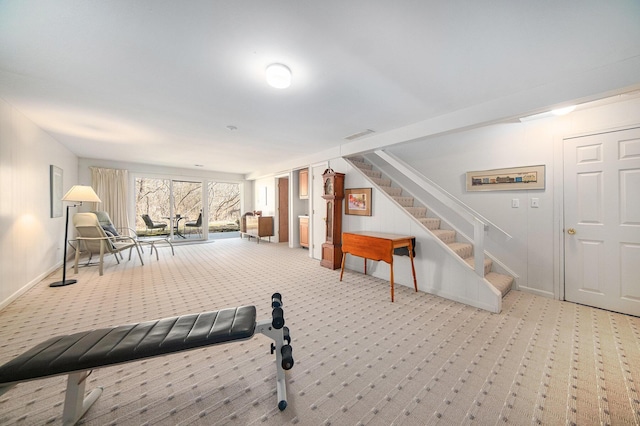 interior space with baseboards and carpet floors