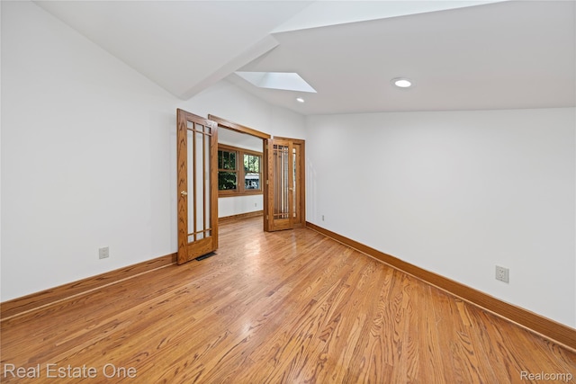 28190 Wildwood Trl, Farmington Hills, MI 48336 - spare room featuring a skylight, light wood finished floors, and recessed lighting