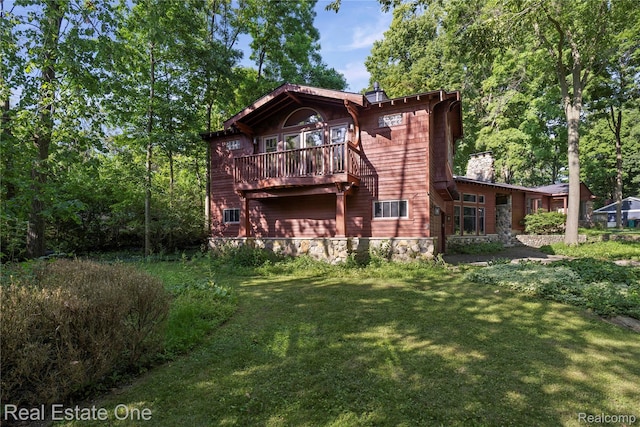 28190 Wildwood Trl, Farmington Hills, MI 48336 - rear view of house with a yard, a balcony, and a chimney