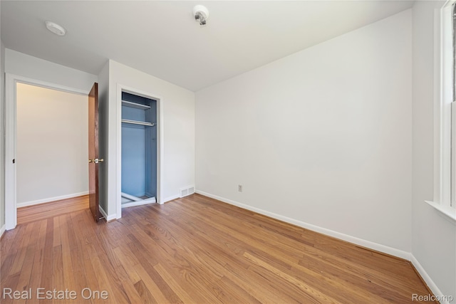 28190 Wildwood Trl, Farmington Hills, MI 48336 - unfurnished bedroom with light wood-style floors and a closet