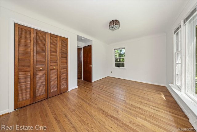 28190 Wildwood Trl, Farmington Hills, MI 48336 - unfurnished bedroom with light wood-style floors and a closet
