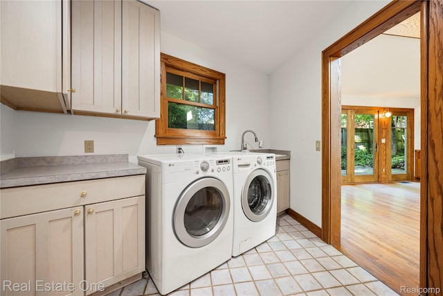 28190 Wildwood Trl, Farmington Hills, MI 48336 - laundry area with cabinet space, washing machine and dryer, and plenty of natural light