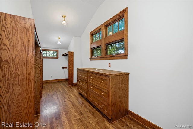 28190 Wildwood Trl, Farmington Hills, MI 48336 - hallway featuring lofted ceiling and dark wood-style floors