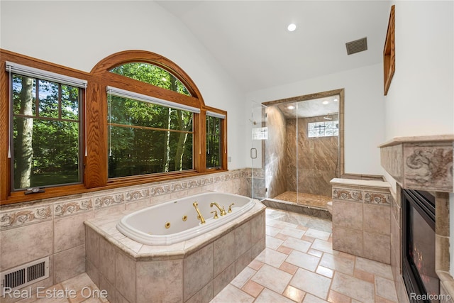 28190 Wildwood Trl, Farmington Hills, MI 48336 - bathroom with a whirlpool tub, a stall shower, and vaulted ceiling