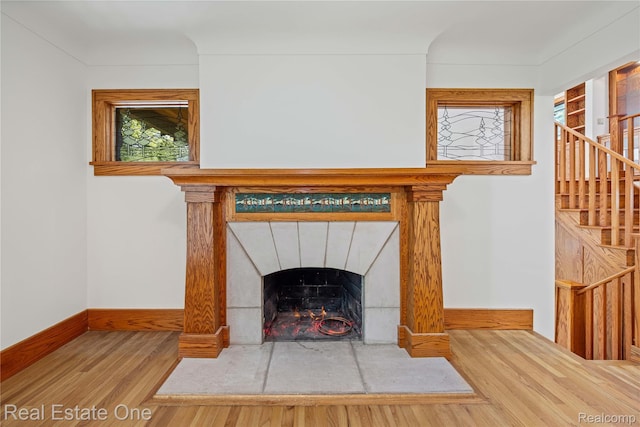 28190 Wildwood Trl, Farmington Hills, MI 48336 - detailed view of wood finished floors and a fireplace with flush hearth