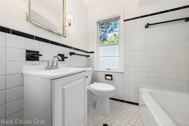 28190 Wildwood Trl, Farmington Hills, MI 48336 - bathroom with tile walls, a tub, vanity, tile patterned floors, and a wainscoted wall