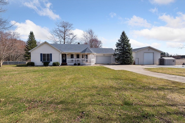 ranch-style house featuring a front lawn, concrete driveway, covered porch, an outdoor structure, and an attached garage