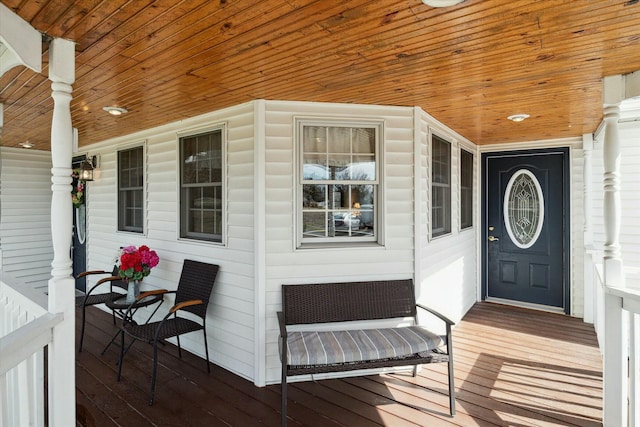 view of exterior entry with covered porch