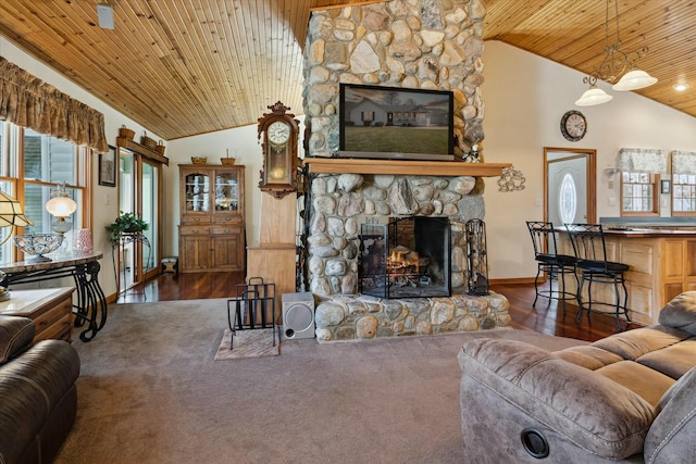 living area with a stone fireplace, high vaulted ceiling, wood ceiling, and wood finished floors