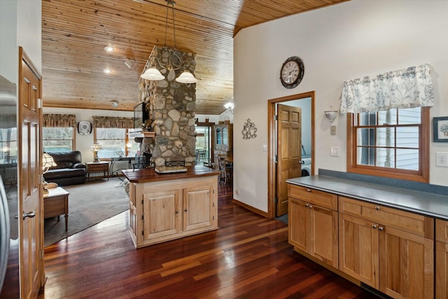 kitchen with dark wood finished floors, a notable chandelier, wood ceiling, and a wealth of natural light