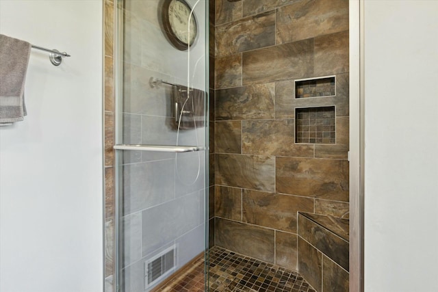 full bath featuring visible vents and a stall shower