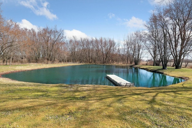 dock area featuring a lawn and a water view