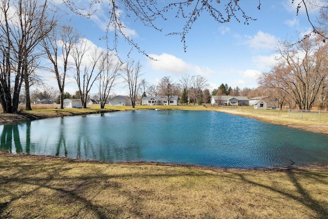 view of water feature with fence