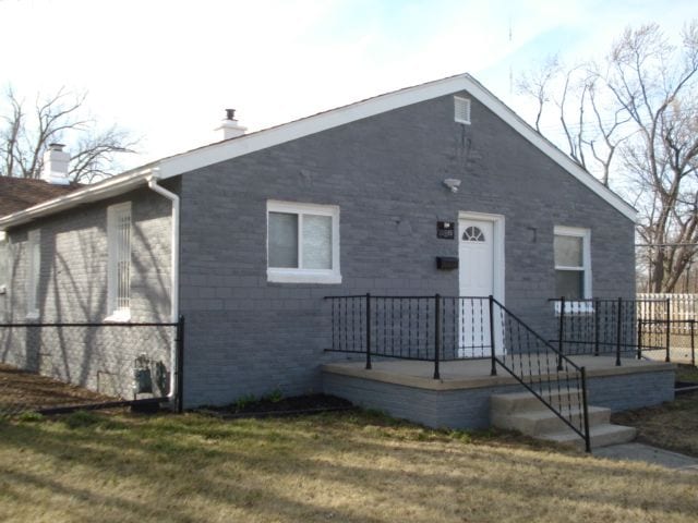 20885 Westview Ave, Ferndale, MI 48220 - view of front facade featuring a chimney and a front yard