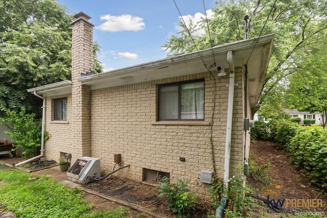 22180 Boulder Ave, Eastpointe, MI 48021 - view of property exterior with a chimney and brick siding