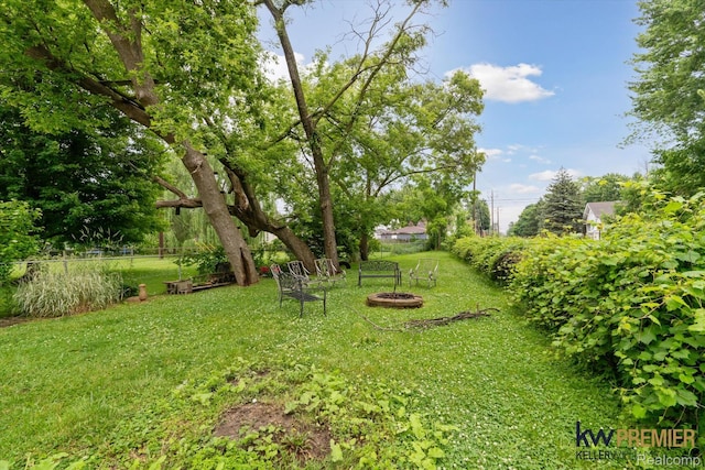 22180 Boulder Ave, Eastpointe, MI 48021 - view of green lawn with an outdoor fire pit