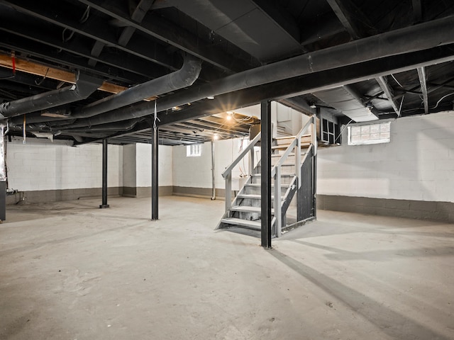 basement featuring stairs