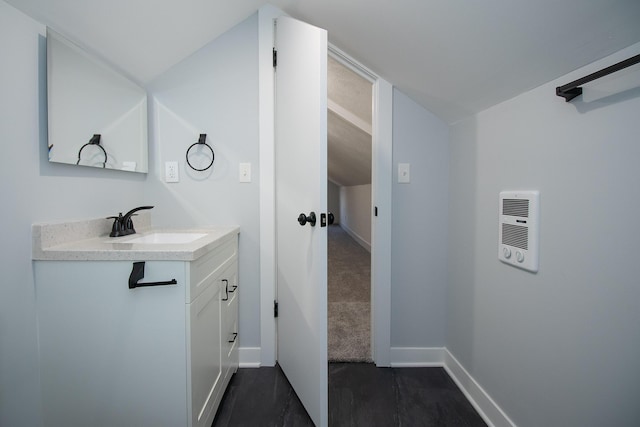 bathroom featuring baseboards and vanity