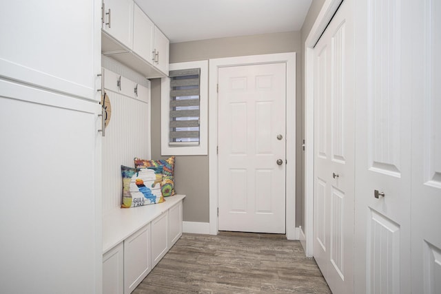 mudroom with light wood-style flooring