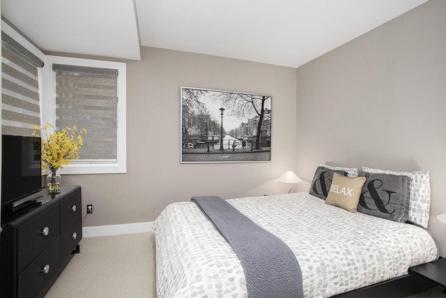 carpeted bedroom with baseboards