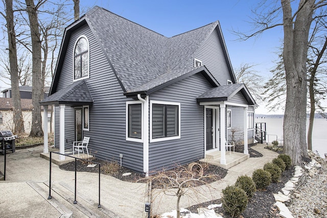 view of front facade with a shingled roof