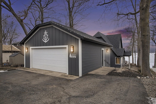 garage at dusk with a garage