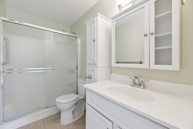 713 Mary Ann Dr, Holly, MI 48442 - full bathroom with vanity, tile patterned floors, toilet, and a shower stall