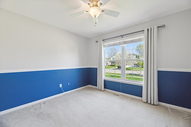 713 Mary Ann Dr, Holly, MI 48442 - carpeted empty room with baseboards, ceiling fan, and visible vents