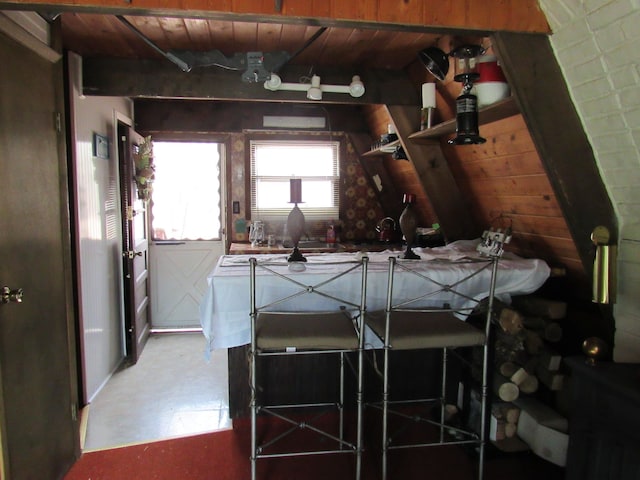 5892 Woodland Dr, Lake, MI 48632 - kitchen with beamed ceiling, open shelves, and wood ceiling