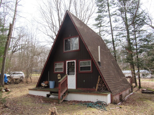 5892 Woodland Dr, Lake, MI 48632 - a-frame style home featuring roof with shingles
