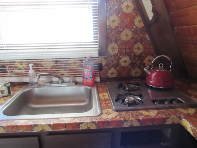 5892 Woodland Dr, Lake, MI 48632 - room details featuring stovetop and a sink