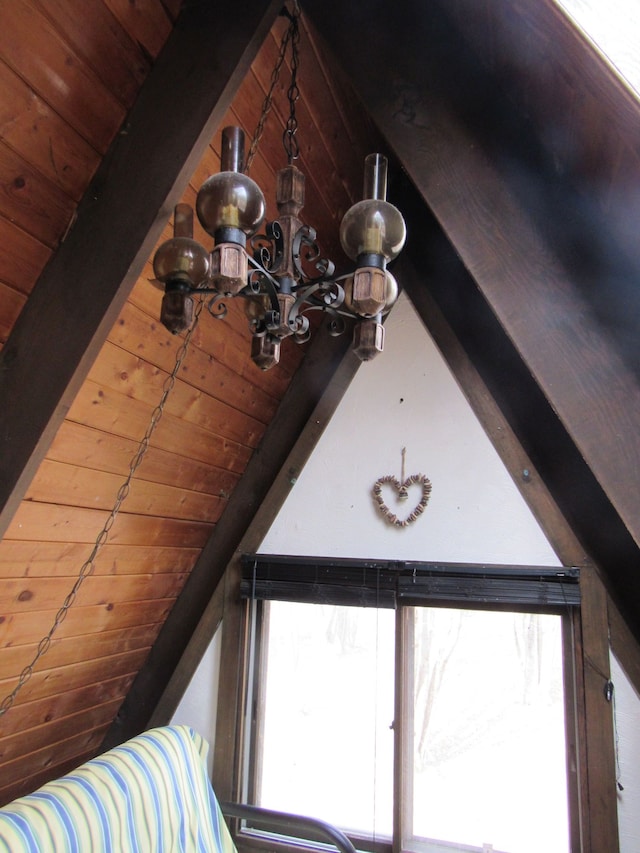 5892 Woodland Dr, Lake, MI 48632 - details featuring an inviting chandelier, wood ceiling, and beam ceiling