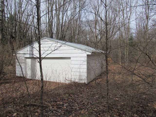 5892 Woodland Dr, Lake, MI 48632 - view of outbuilding with an outdoor structure and a garage