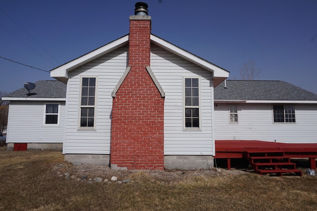 1758 Manor Rd, Au Gres, MI 48703 - rear view of house featuring a chimney and a shingled roof