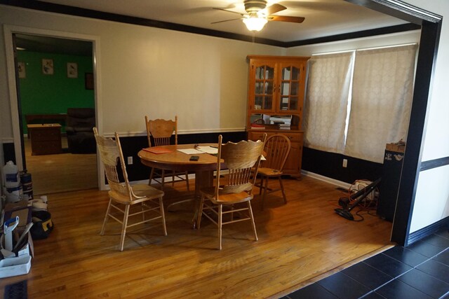 1758 Manor Rd, Au Gres, MI 48703 - dining room featuring baseboards, wood finished floors, ornamental molding, and a ceiling fan