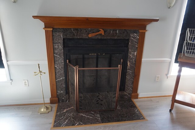 1758 Manor Rd, Au Gres, MI 48703 - details with a fireplace, baseboards, and wood finished floors